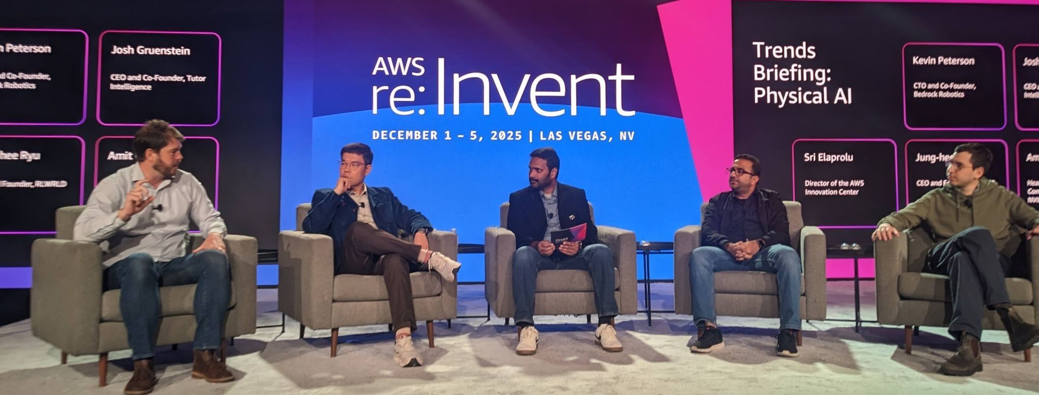An image from the Trends briefing on physical AI from AWS re:Invent 2025. Featured speakers include Kevin Peterson (CTO and Co-Founder, Bedrock Robotics), Josh Gruenstein (CEO and Co-Founder, Tutor Intelligence), Sri Elaprolu (Director of the AWS Innovation Center), and Jung-hee Ryu. The session is titled "Trends Briefing: Physical AI."